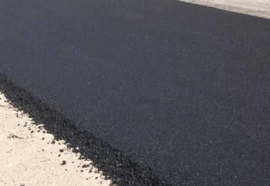 Freshly laid bituminous road surface